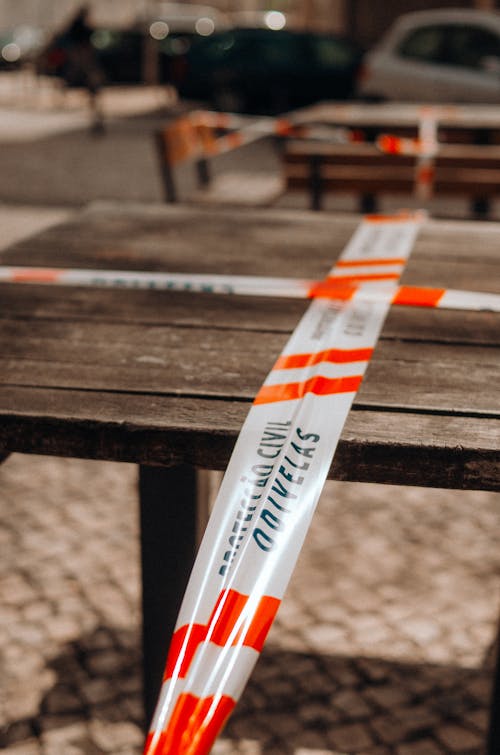 Free Table Wrapped With Barricade Tape Stock Photo