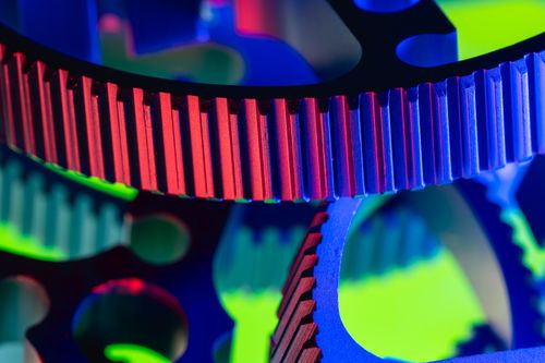 Free Vibrant macro shot of colorful industrial gears showcasing precision engineering. Stock Photo