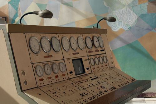 Free Vintage control panel with dials and lights, reflecting industrial technology history. Stock Photo