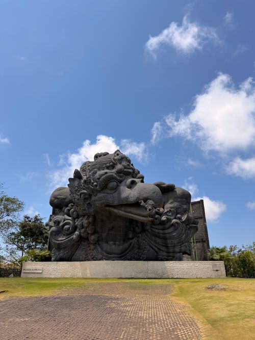 Free A grand view of the Garuda Wisnu Kencana statue in Bali against a vibrant blue sky, perfect for travel themes. Stock Photo