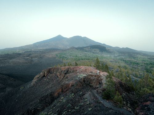 Free Stunning aerial view of volcanic terrain in Tenerife, featuring lush greenery and expansive vistas. Stock Photo