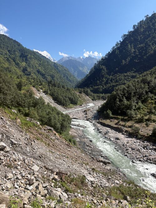 Free Breathtaking view of a river winding through lush green valleys in the Garhwal Himalayas, India. Stock Photo