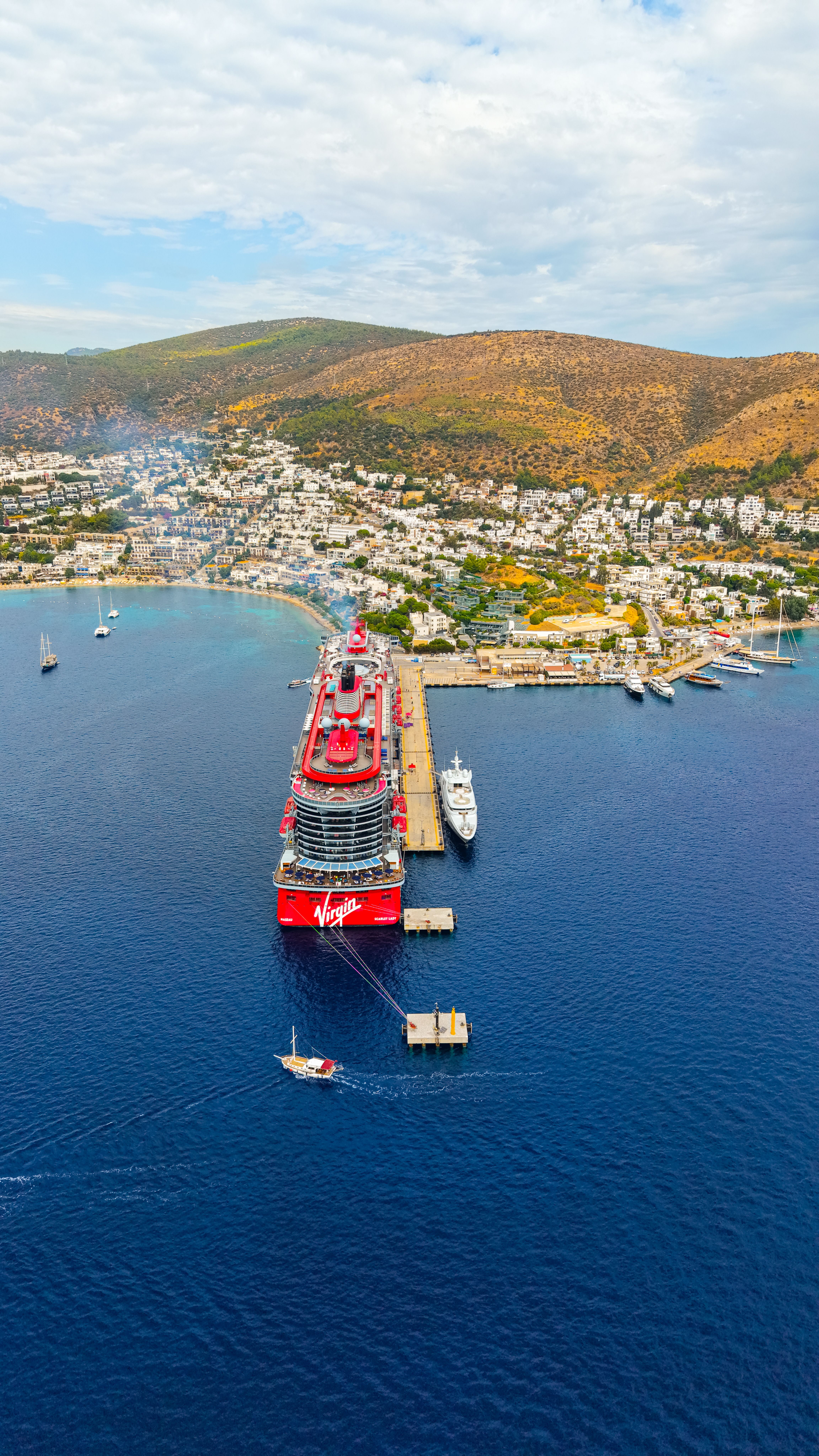A breathtaking aerial view of cruise ships docked in Bodrum harbor, showcasing the stunning coastal landscape of Türkiye.