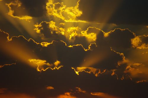 Free Capture of a dramatic sunset with golden clouds and sun rays in Baku, Azerbaijan. Stock Photo