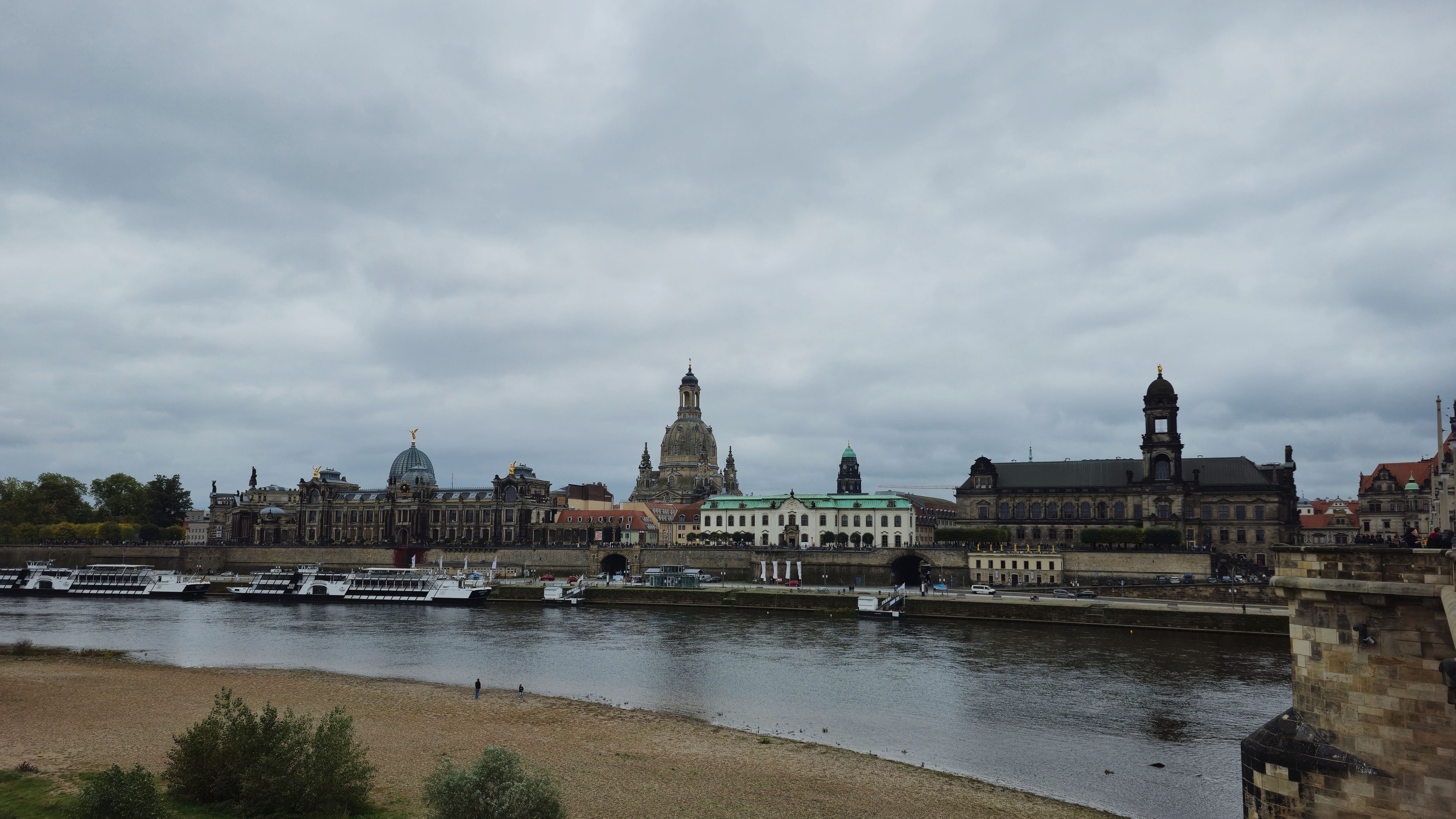 Explore the historic skyline of Dresden along the scenic Elbe River, featuring iconic landmarks and beautiful architecture.
