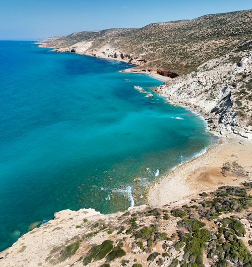 Free A breathtaking aerial view of the rugged Libyan coastline with clear turquoise waters. Stock Photo