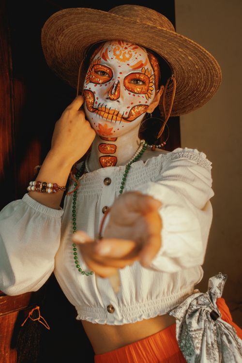 Free Elegant Catrina in traditional attire offering hand, symbolizing the Day of the Dead. Stock Photo