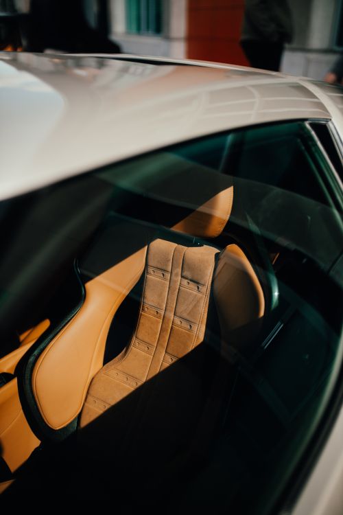 Free Close-up of luxurious leather car seat seen through the window in Rotterdam. Stock Photo