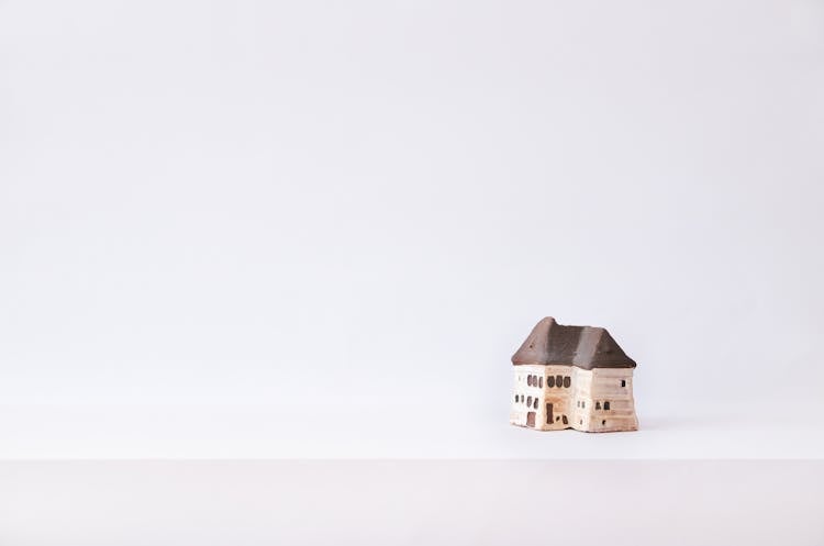 Miniature Clay House In White Background