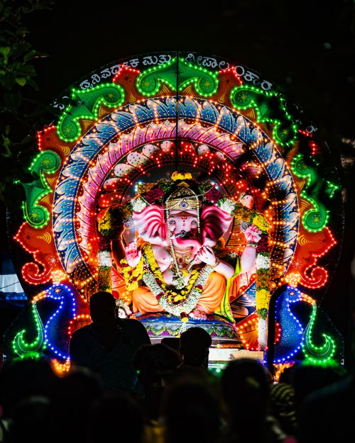 Free Colorful and vibrant Ganesh idol illuminated at night during Ganesh Chaturthi in Bengaluru, India. Stock Photo