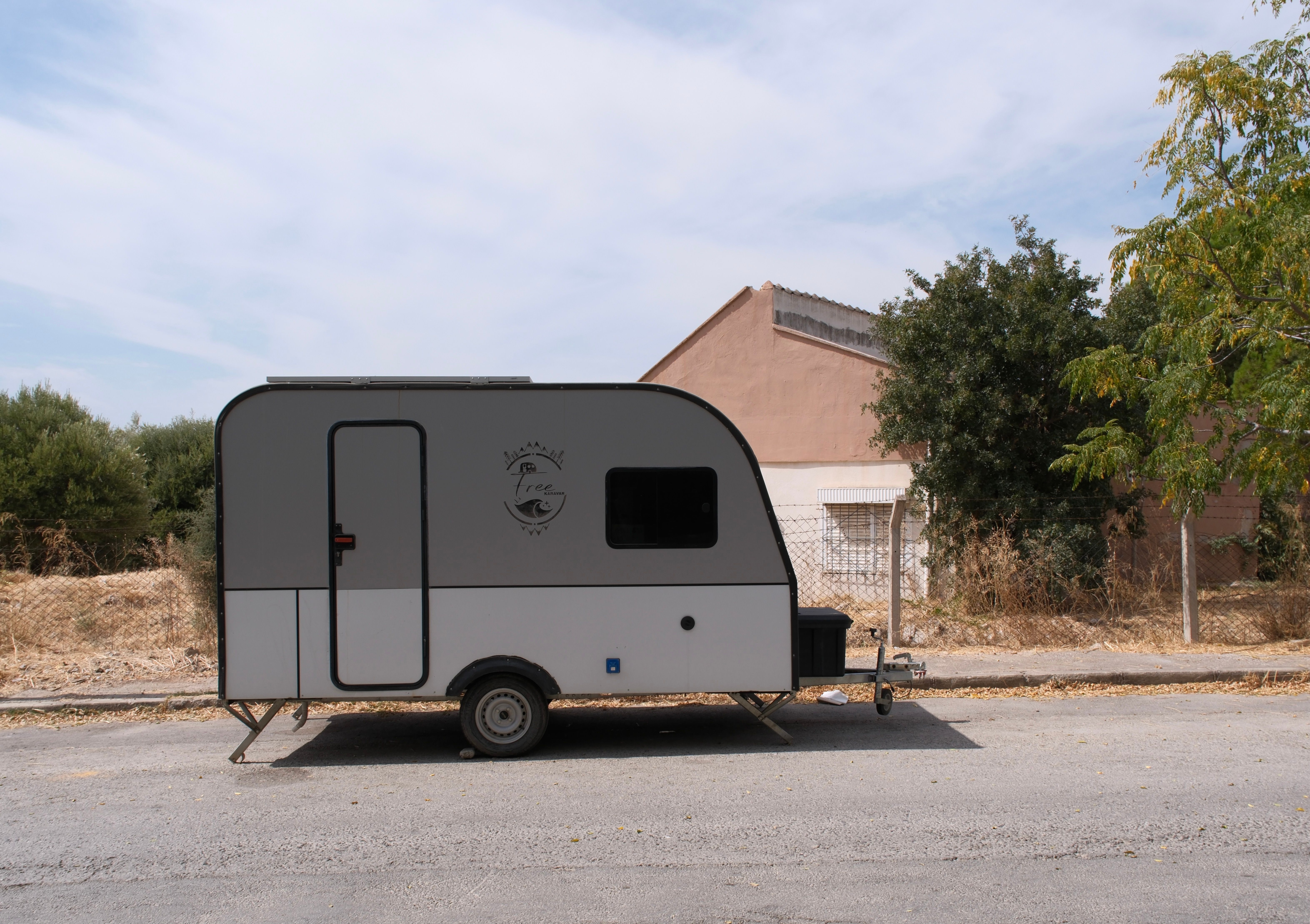 Sleek modern caravan parked on a sunny street in İzmir, Turkey.
