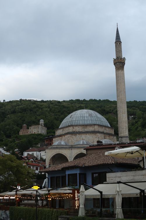 Free Sinan Pasha Mosque with minaret amid lush green hills, Kosovo. Stock Photo