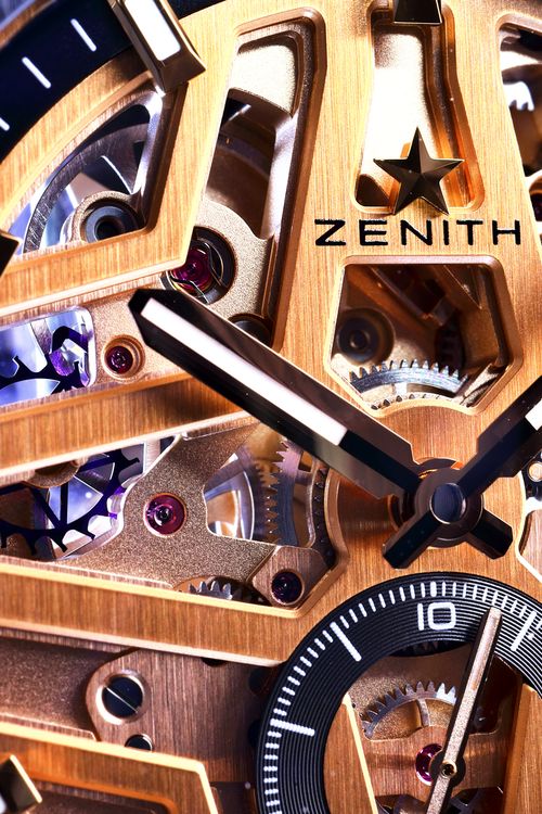 Free Close-up of a Zenith gold skeleton watch showcasing detailed mechanical gears and elegant design. Stock Photo