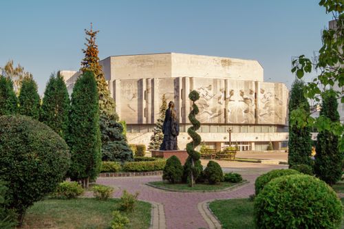 Free Stunning view of a sculpture and building in a garden setting in Kyiv, Ukraine. Stock Photo
