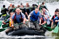 Men Paddling in Inflatable Raft Boat during Daytime