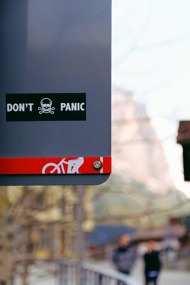 Don't Panic Sticker On Signage