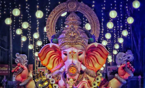 Free A grand statue of Lord Ganesha illuminated by lights during a festival celebration in Mumbai, India. Stock Photo
