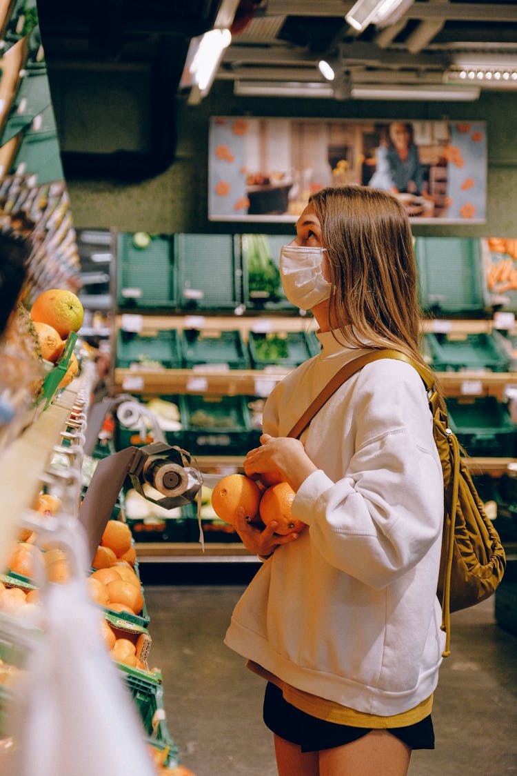 Woman Wearing Mask In Supermarket