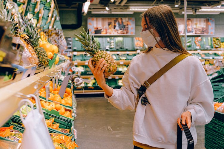 Woman Wearing Mask In Supermarket