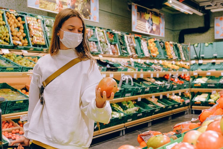 Woman Wearing Mask In Supermarket