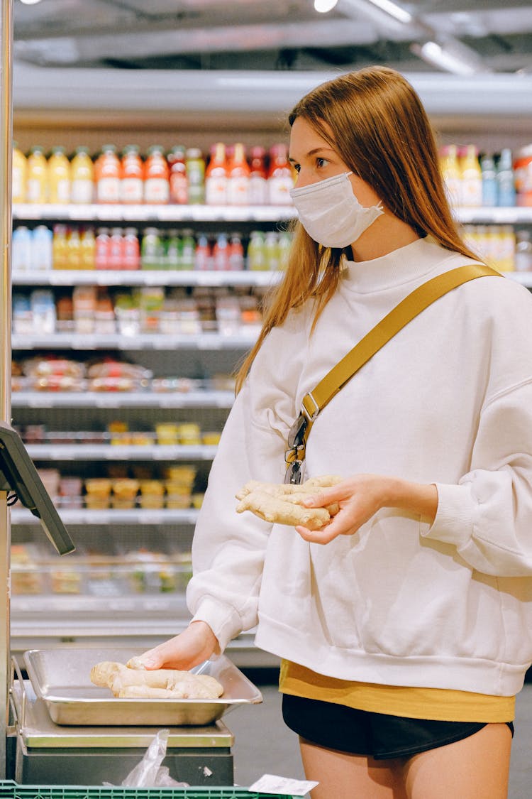 Woman Wearing Mask In Supermarket