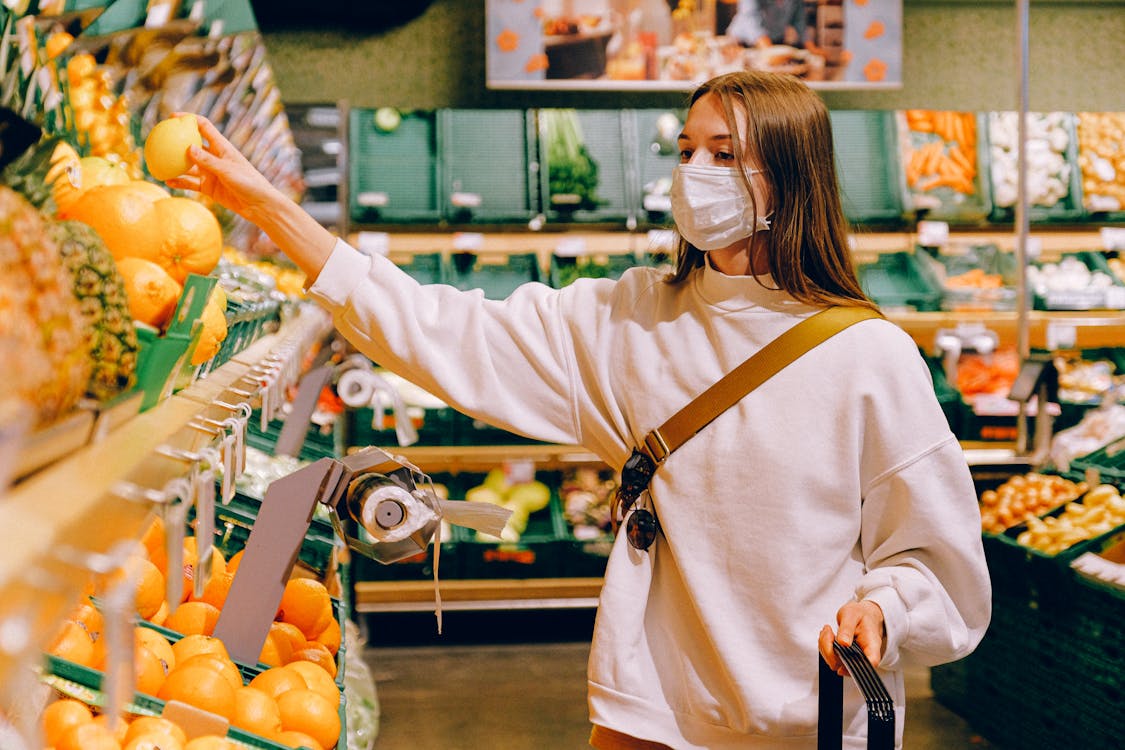 Free Woman Wearing Mask in Supermarket Stock Photo