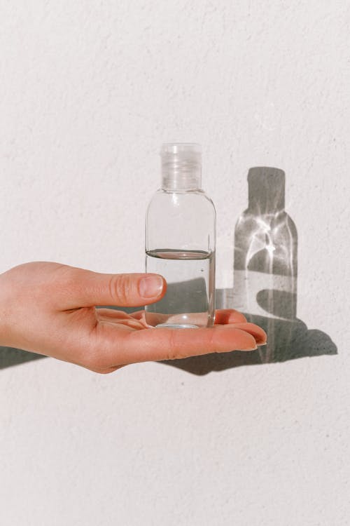 Free Person Holding Hand Sanitizer Stock Photo
