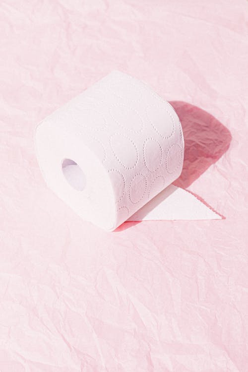 Free White Tissue Roll On Pink Surface Stock Photo