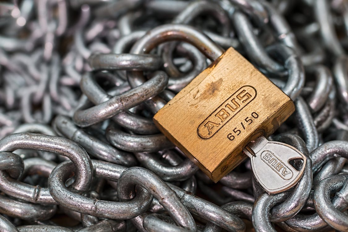 Free Gold-colored Abus Padlock With Key Stock Photo
