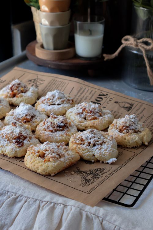 Free Freshly baked cookies with powdered sugar on a wire rack for cooling. Stock Photo