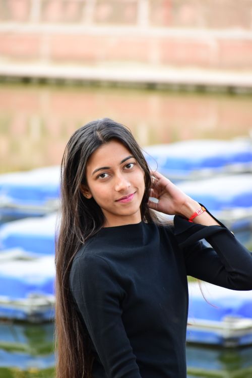 Free Candid portrait of a young woman outdoors in Ranchi, India with a serene expression. Stock Photo