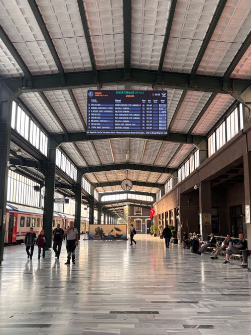Free Spacious interior of Ankara train station featuring travelers and modern architecture elements. Stock Photo