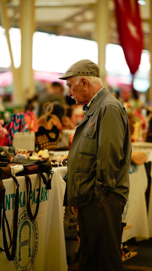 Free An elderly man browsing stalls at a lively flea market in Bursa, Turkey. Stock Photo