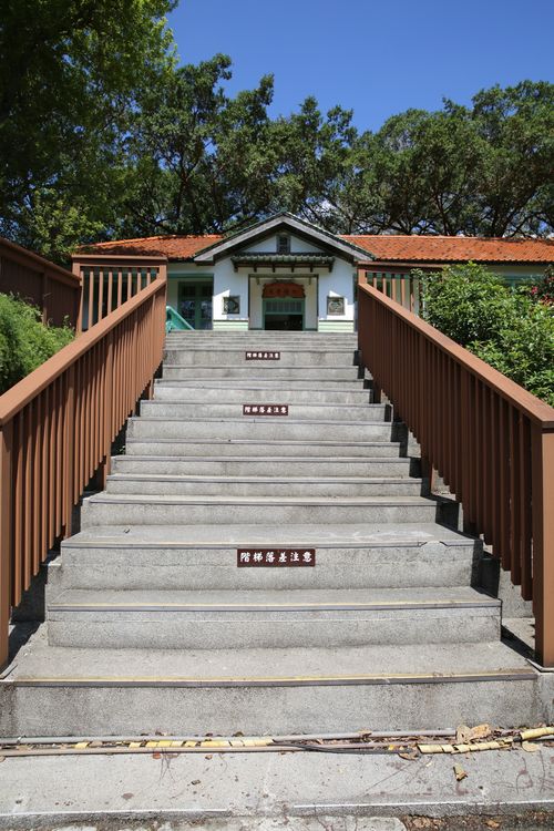 Free Wide stone staircase with wooden railing leading to a traditional building entry. Stock Photo