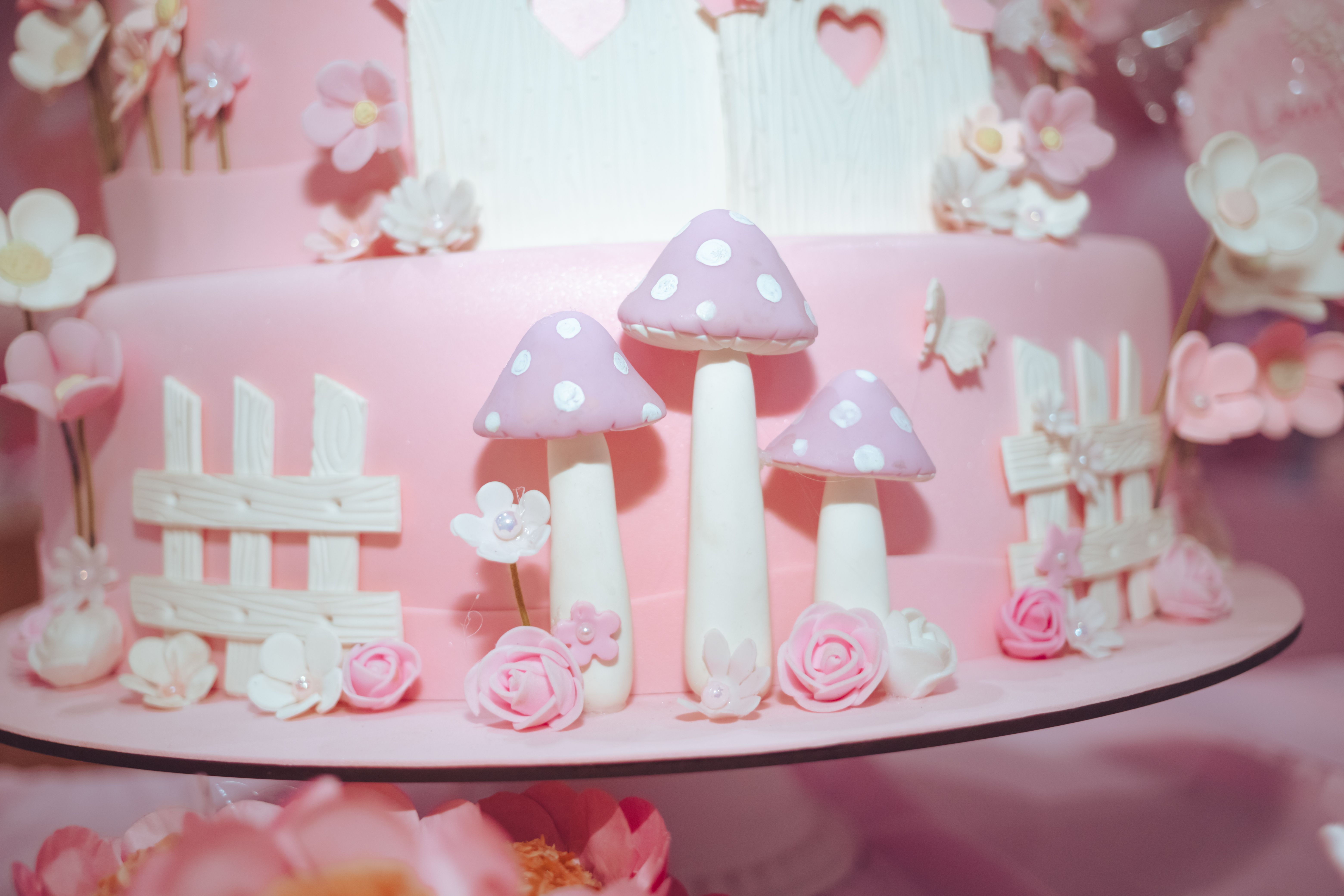 A custom birthday cake being decorated