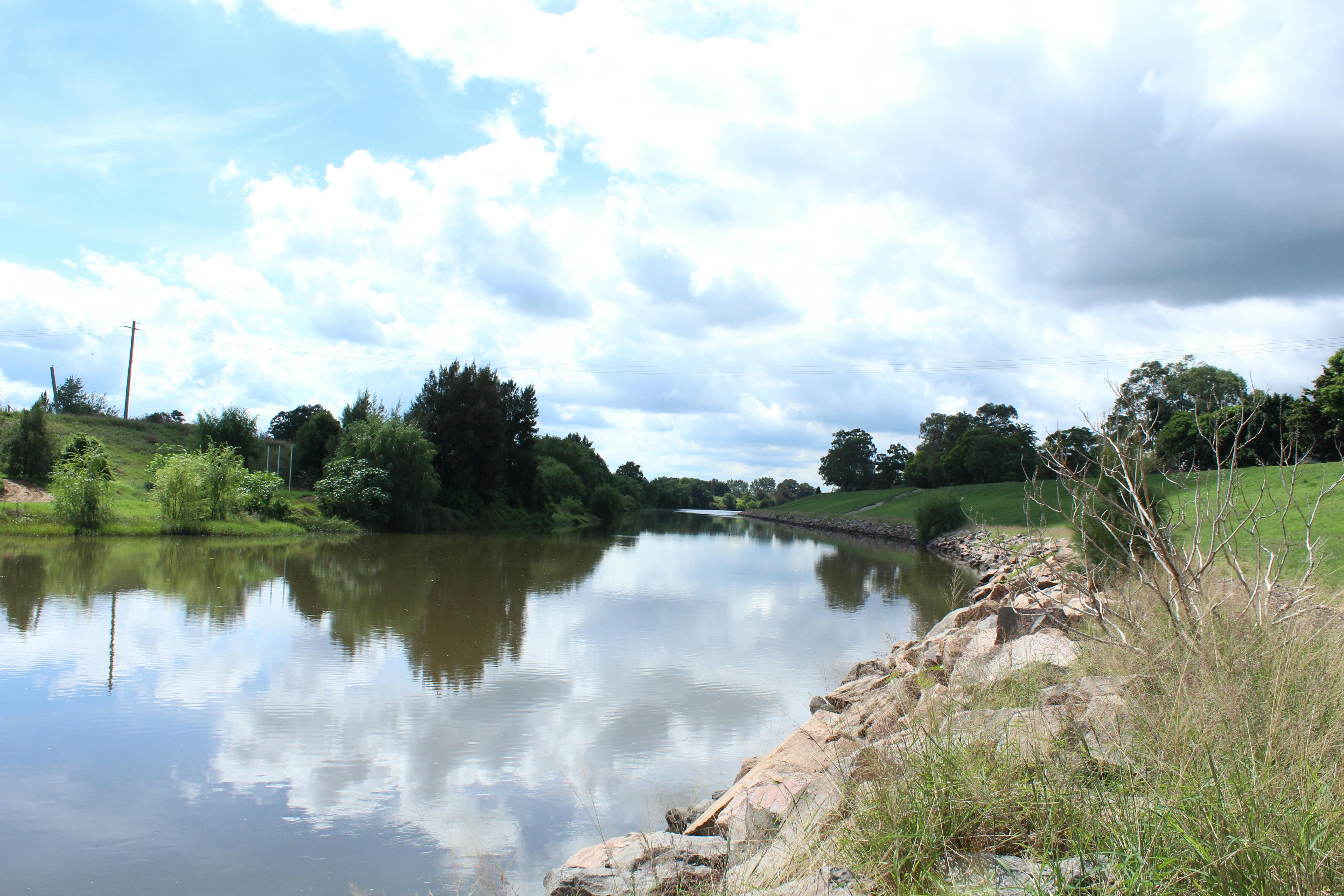 Person taking a photo with a compact digital camera at night