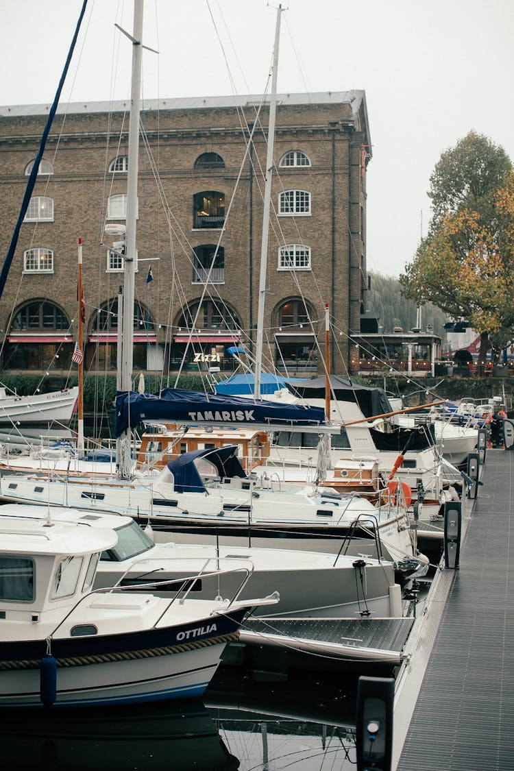 White And Blue Boat On Dock