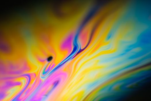 Colorful abstract swirl pattern evoking motion and fluidity.
