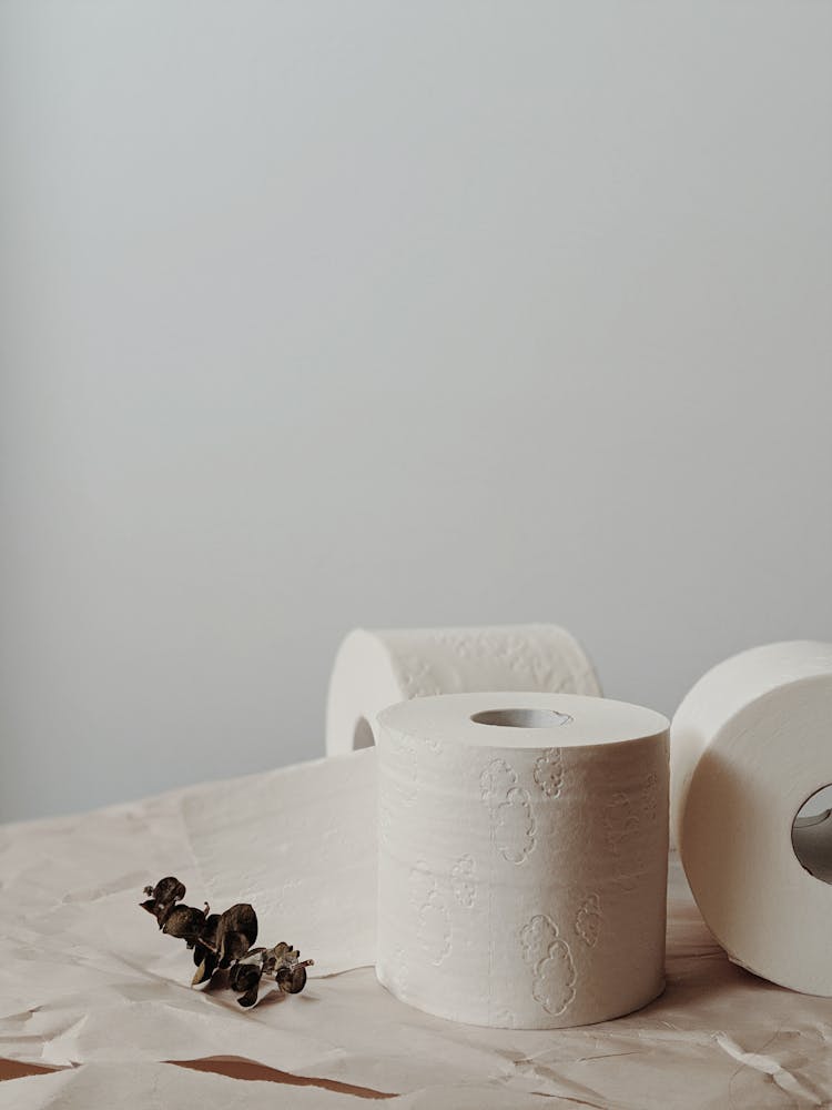 White Toilet Paper Roll On White Table