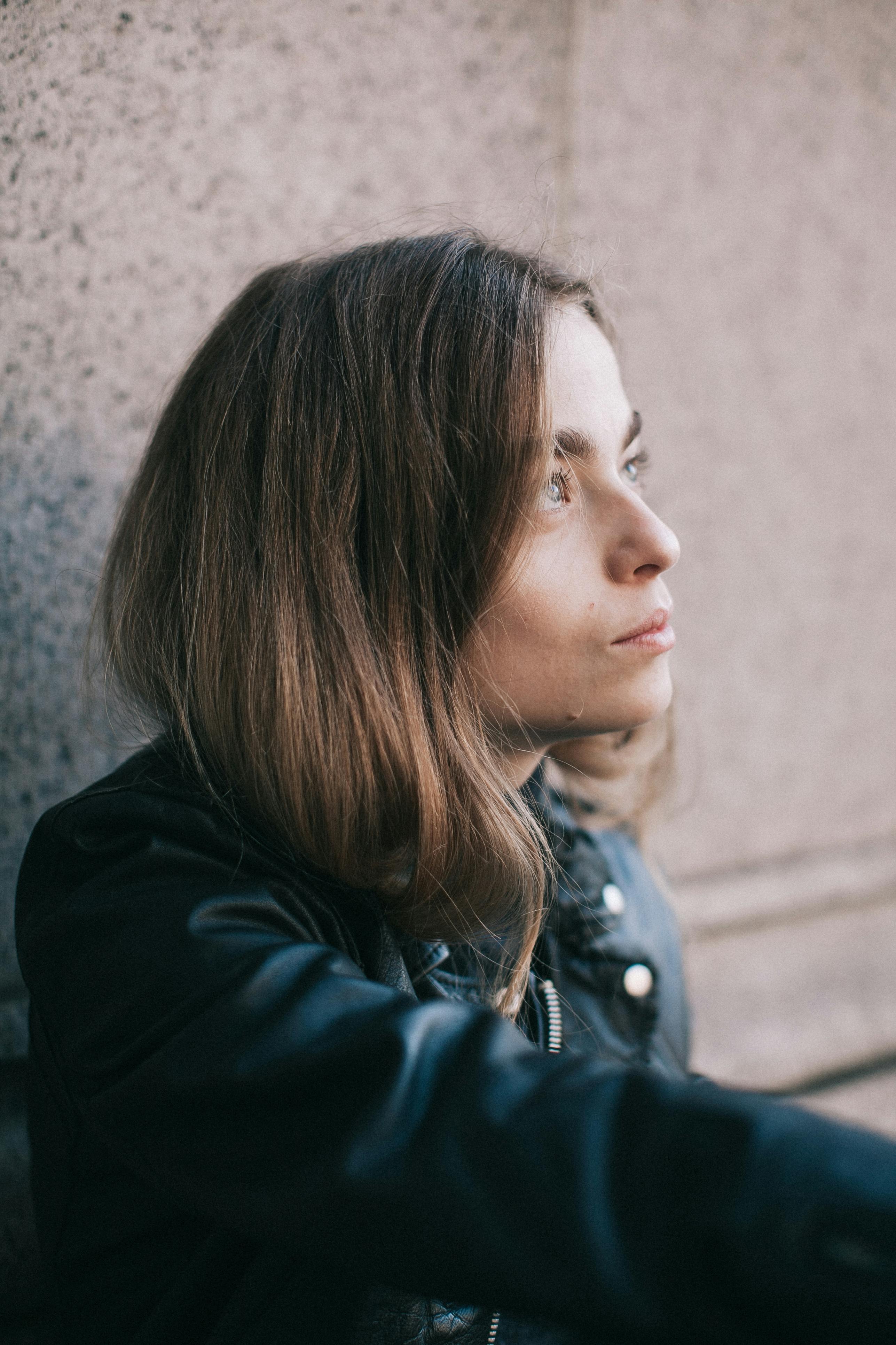 Woman in Black Jacket Looking Up · Free Stock Photo