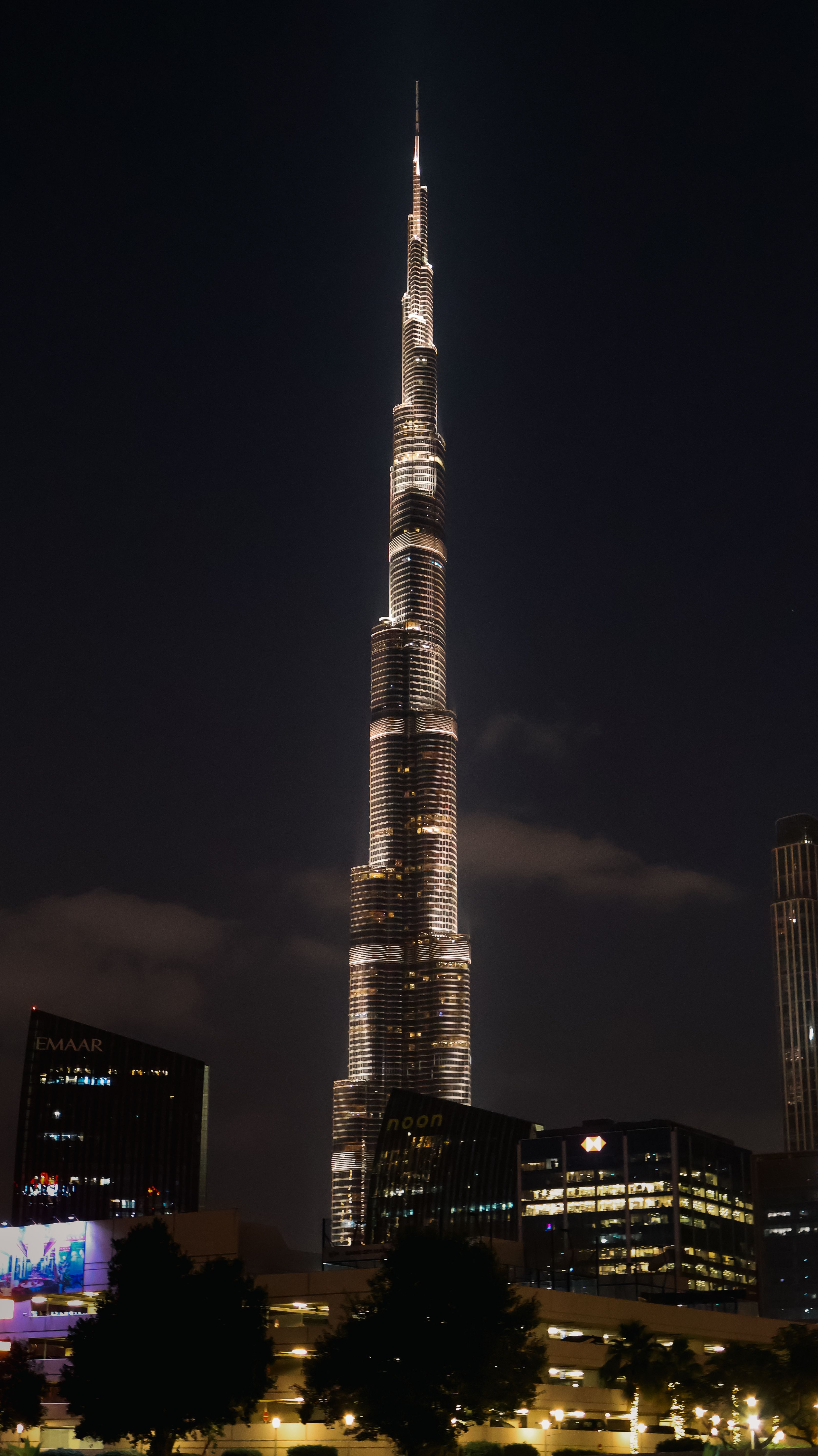 Elegant night shot of Burj Khalifa in Dubai showcasing its architectural magnificence.