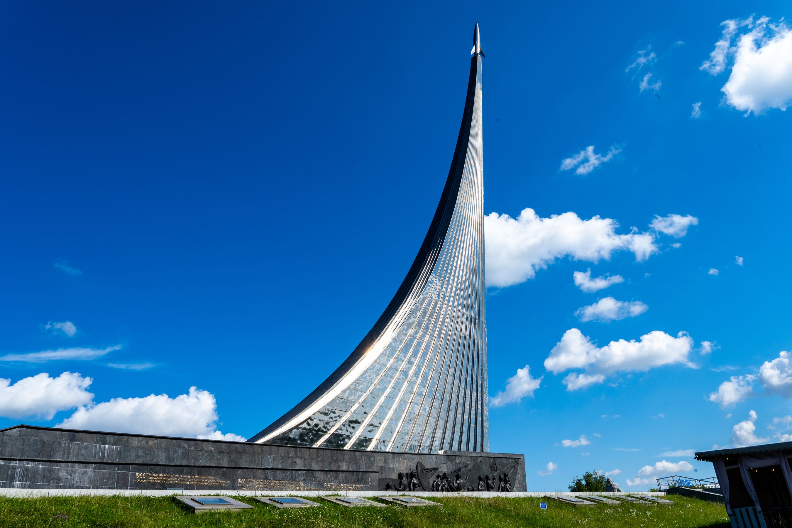 Striking view of the monument's towering structure with clear skies in Moscow. Captures modern architecture.