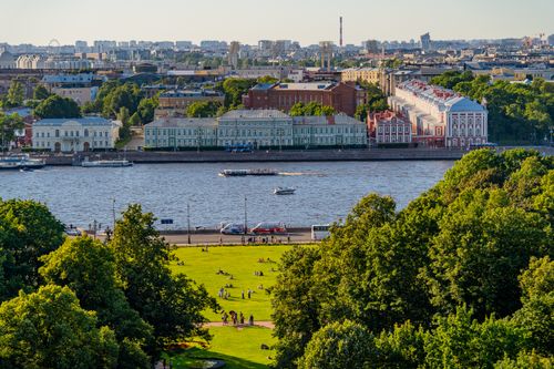 Free Aerial view of a sunny day by the Neva River in St. Petersburg, featuring vibrant city architecture. Stock Photo