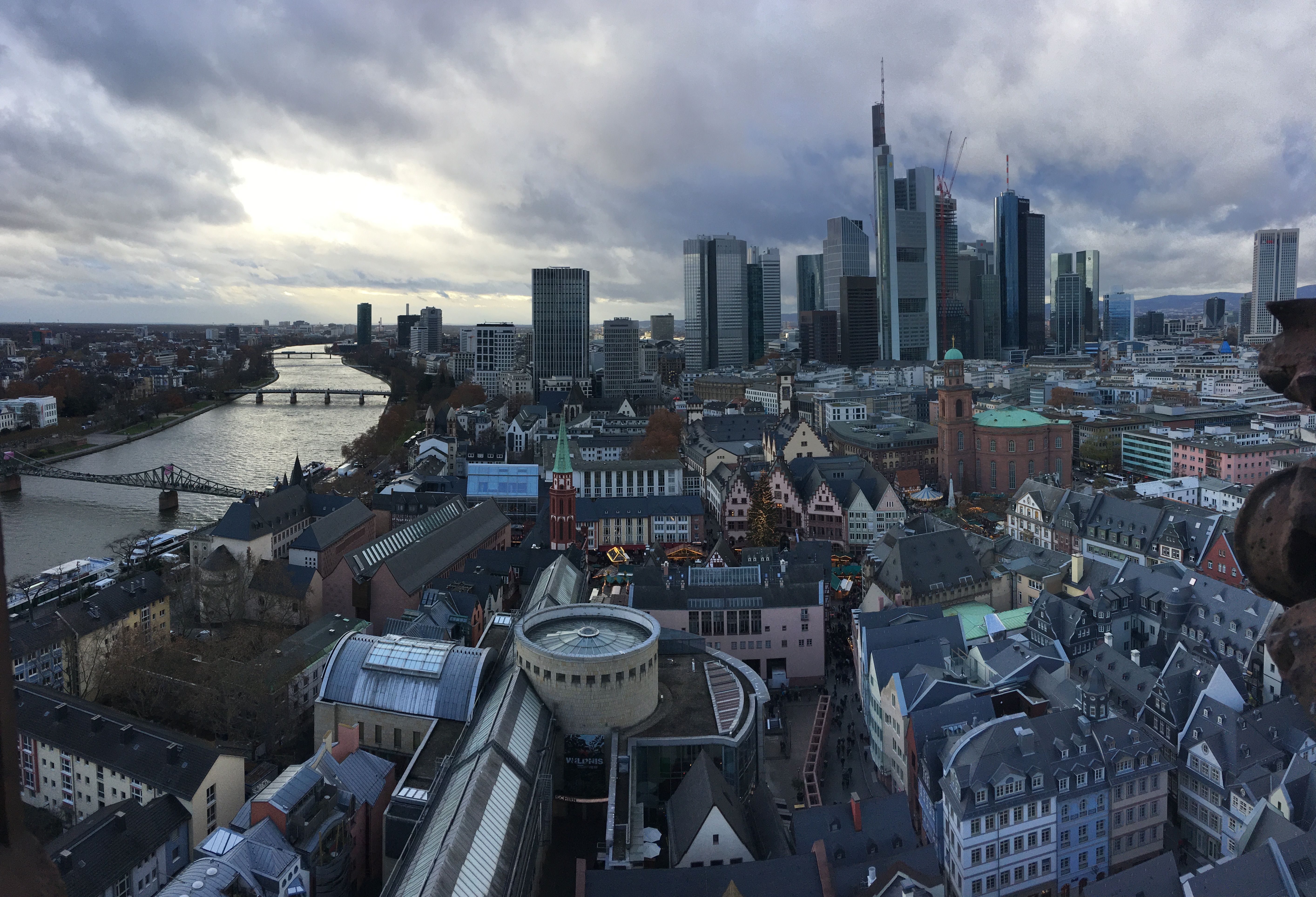Aerial view of Frankfurt showcasing modern skyline and River Main at daytime.