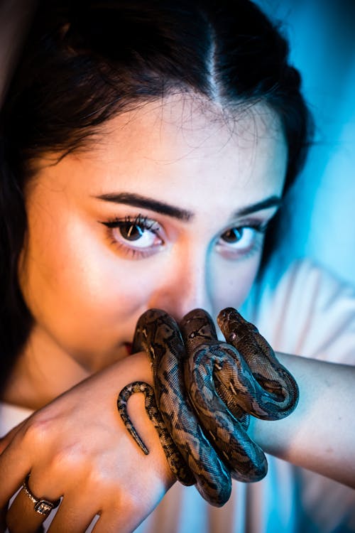 Woman With Snake On Her Wrist