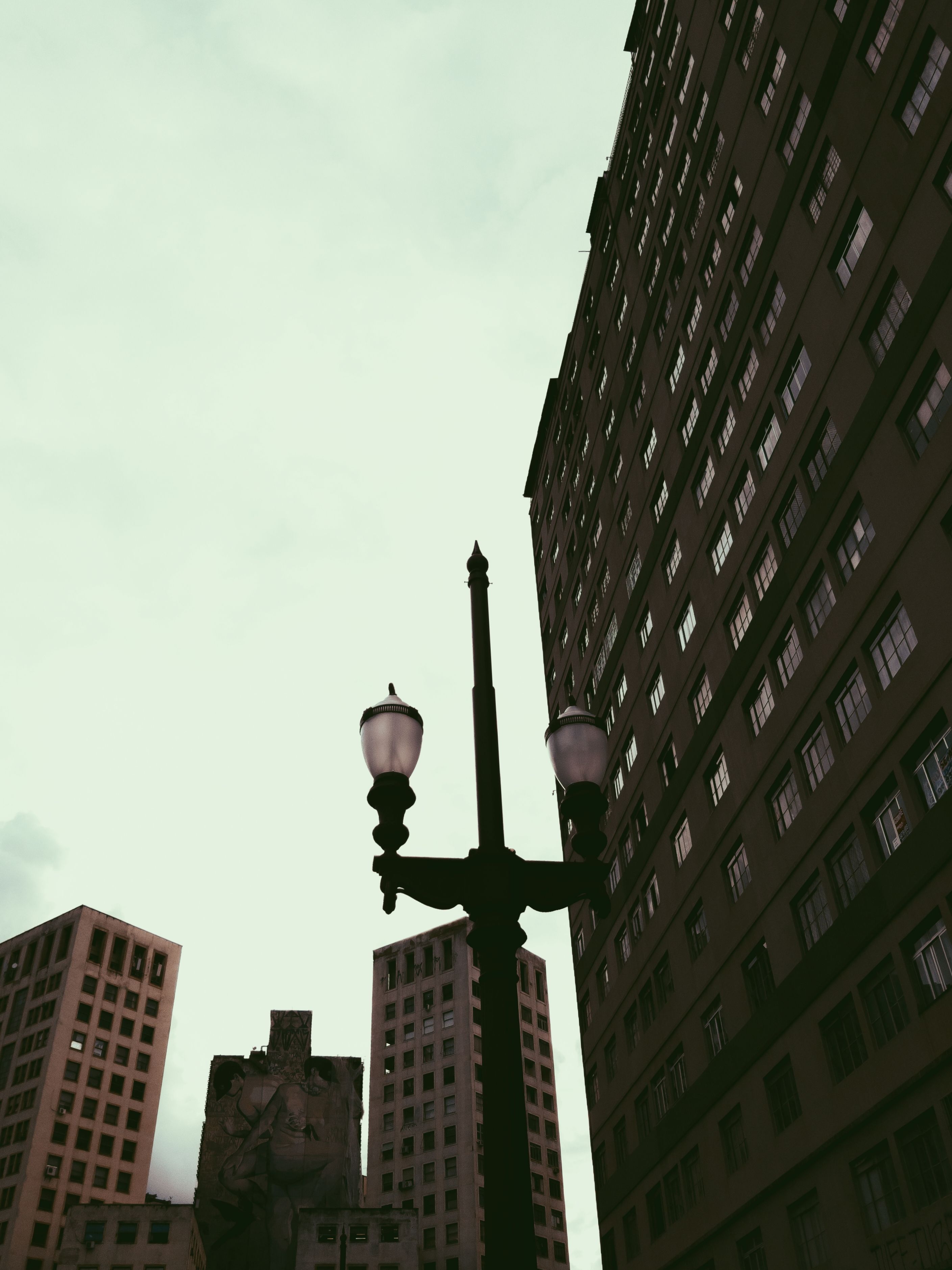 View of High Rise Building With Green Glass Windows · Free Stock Photo