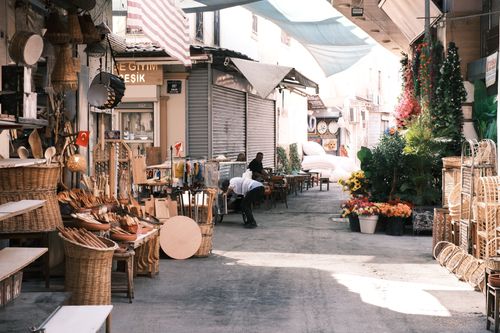 Free Explore a vibrant street market in İzmir with colorful displays and local artistry. Stock Photo