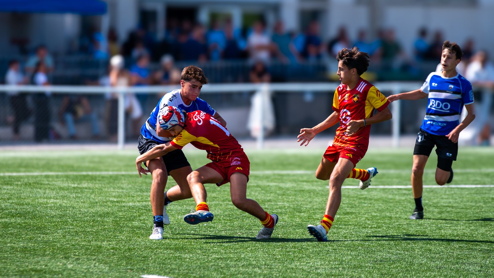 Youth players practising tackle technique