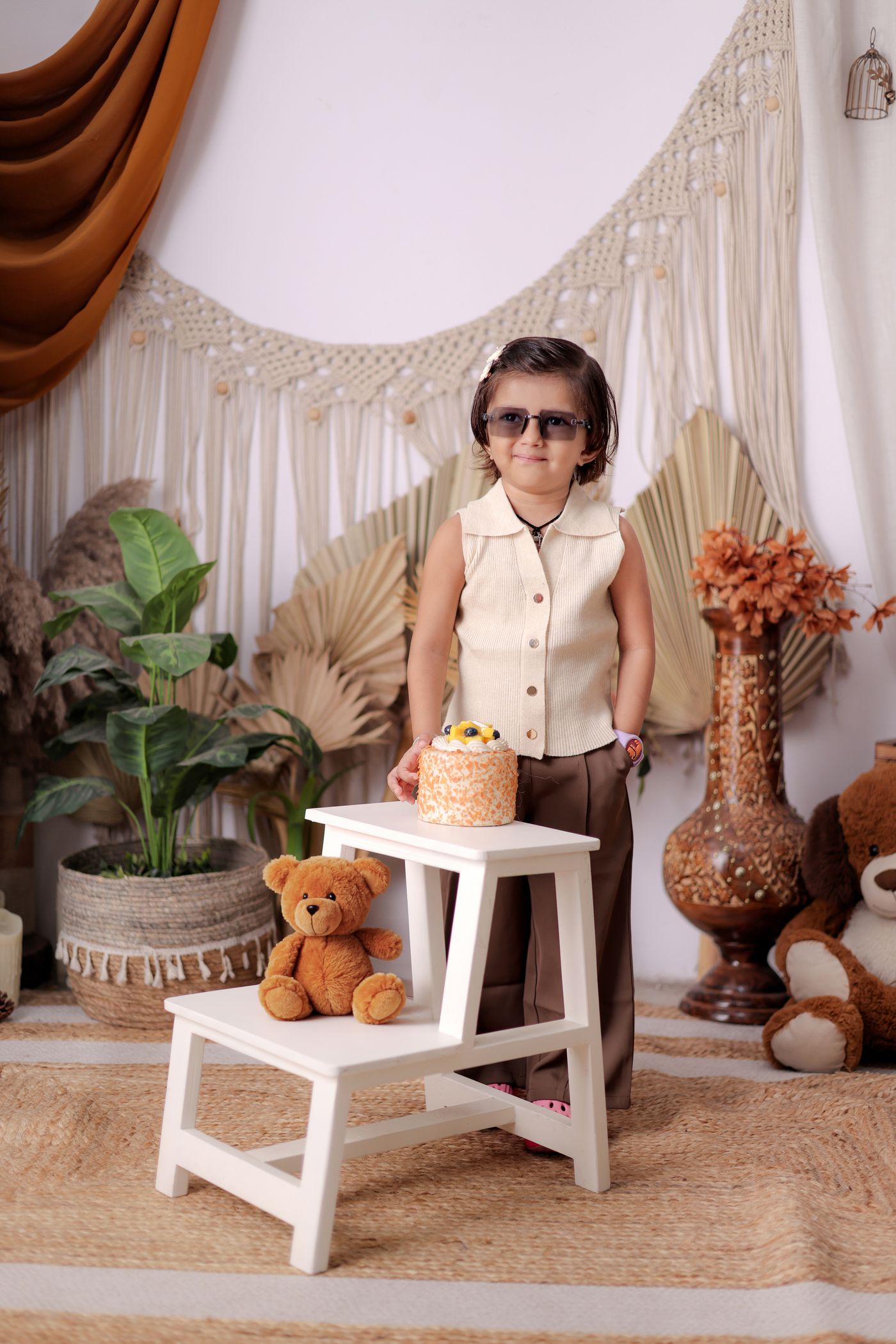 Stylishly dressed toddler in a vintage-styled room