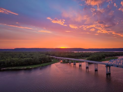 Free A breathtaking sunset over a bridge crossing the Mississippi River in Wabasha, Minnesota, USA. Stock Photo
